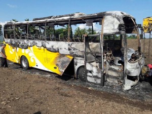 The bus owned by Yellow Bus Lines after it was torched by suspected New People’s Army rebels in Tupi town in South Cotabato province in the Philippines. (McLha Dhaldives Joven Tonacao)