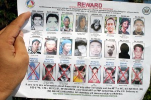 Wanted posters show photographs of Isnilon Hapilon, who is the emir of ISIS in the Philippines. (Mindanao Examiner Photo)