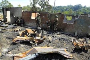 Army soldiers take a rest during a military offensive against jihadists in Lanao del Sur province in the restive Muslim autonomous region. Fierce clashes are also reported in Maguindanao and near provinces. (Mindanao Examiner Photo - Mark Navales)